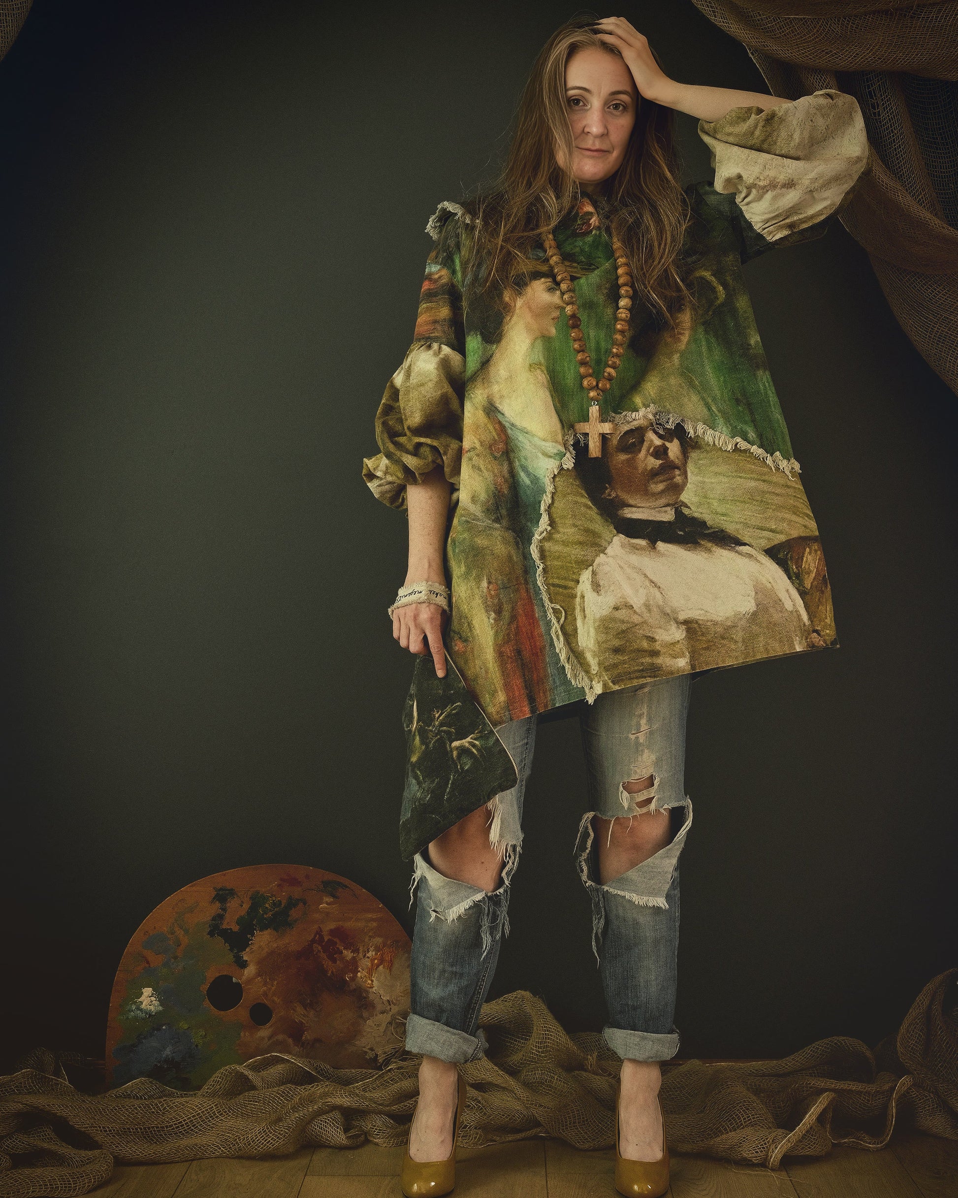 woman wearing avant garde linen dress printed with 19th century artwork