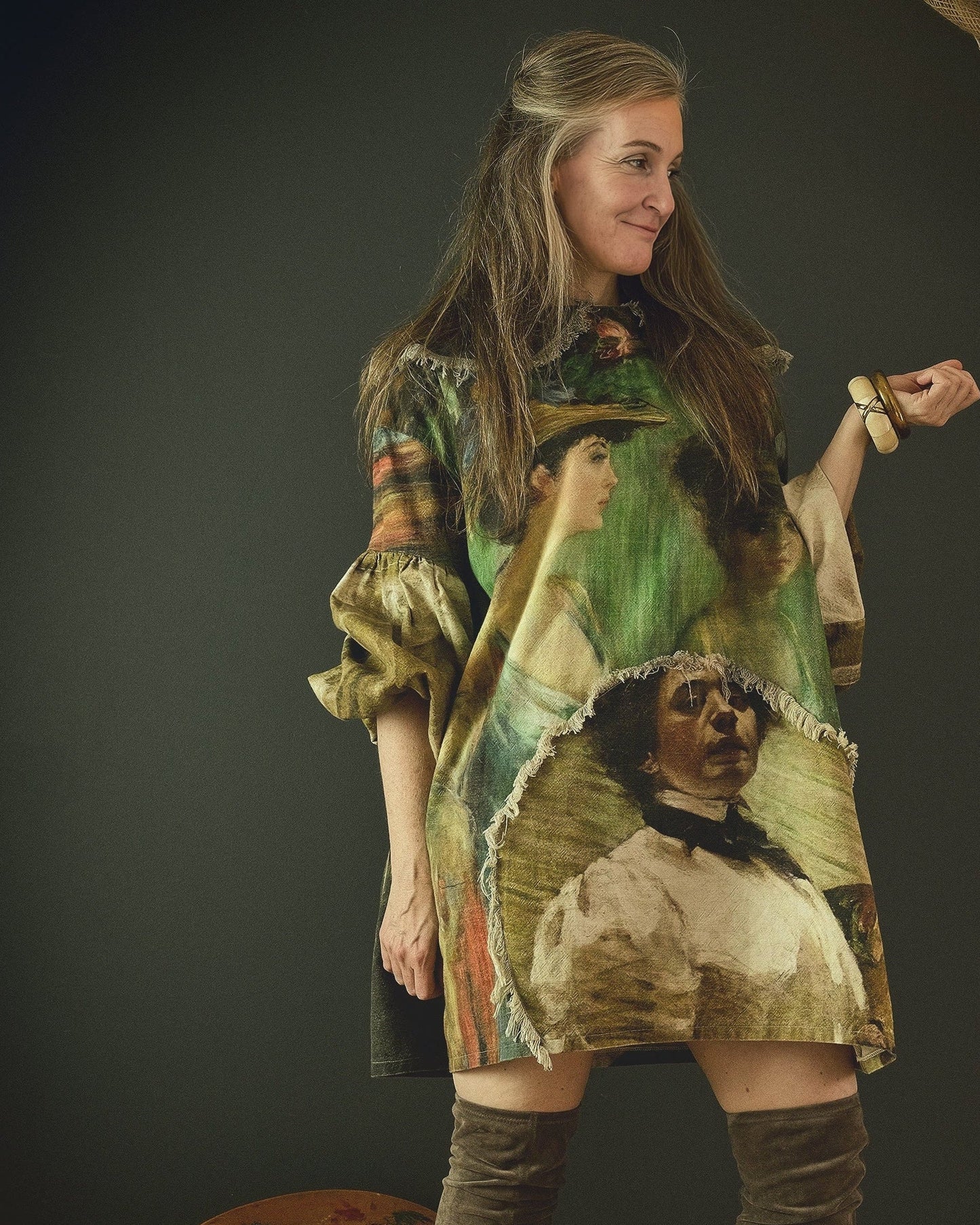 woman wearing avant garde linen dress printed in bold 19th century artwork