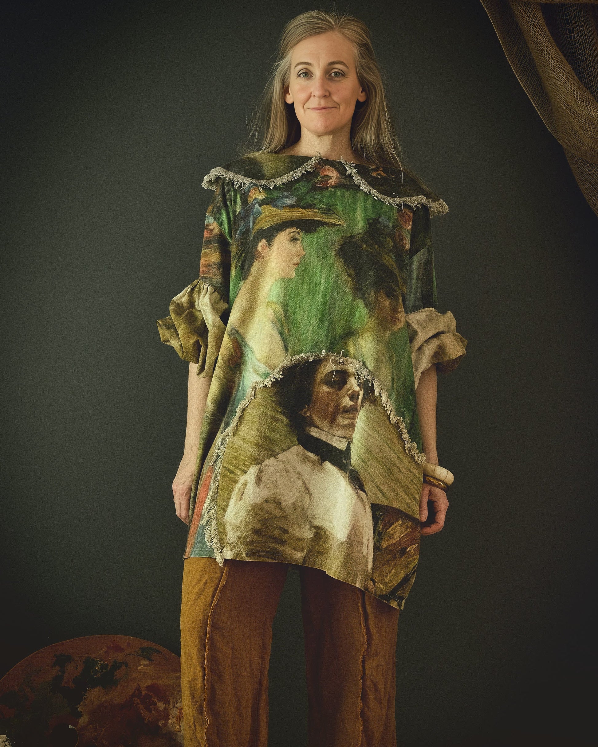 woman wearing a cotton linen dress with bold 19th century artwork print