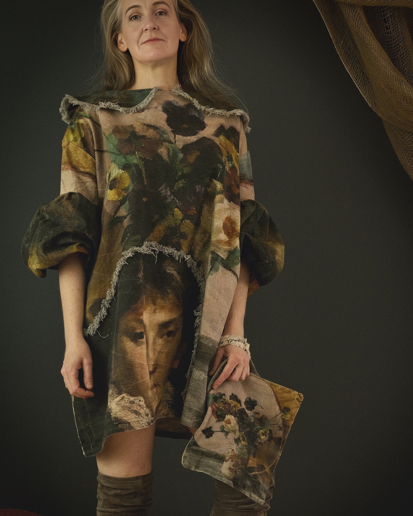 woman wearing cotton linen dress printed in bold 19th century artwork